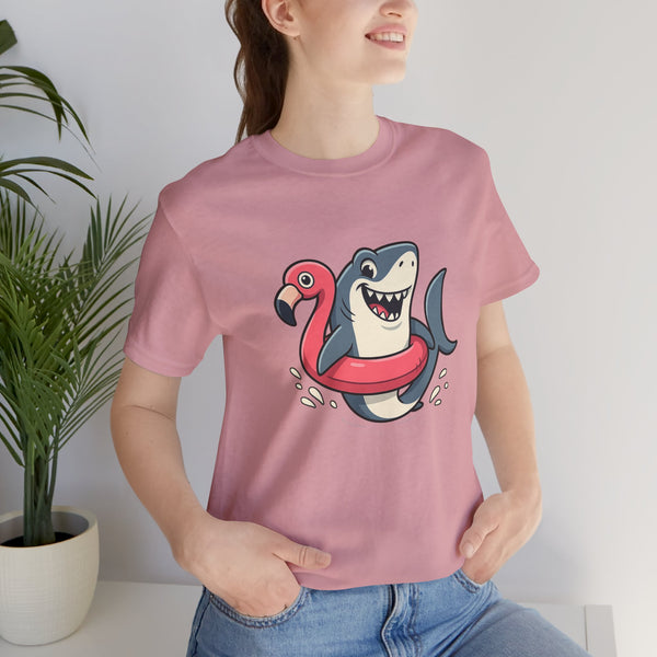 Dusty pink crew-neck T-shirt featuring shark holding flamingo floatie graphic