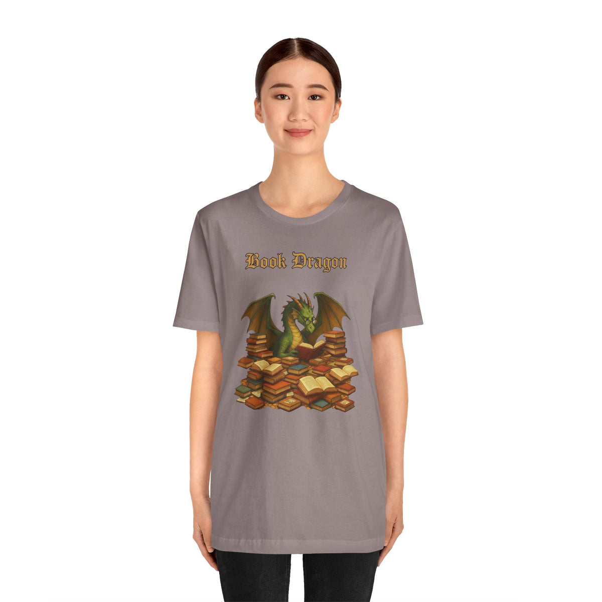 Gray crewneck T-shirt on model, front graphic of dragon surrounded by stacked books