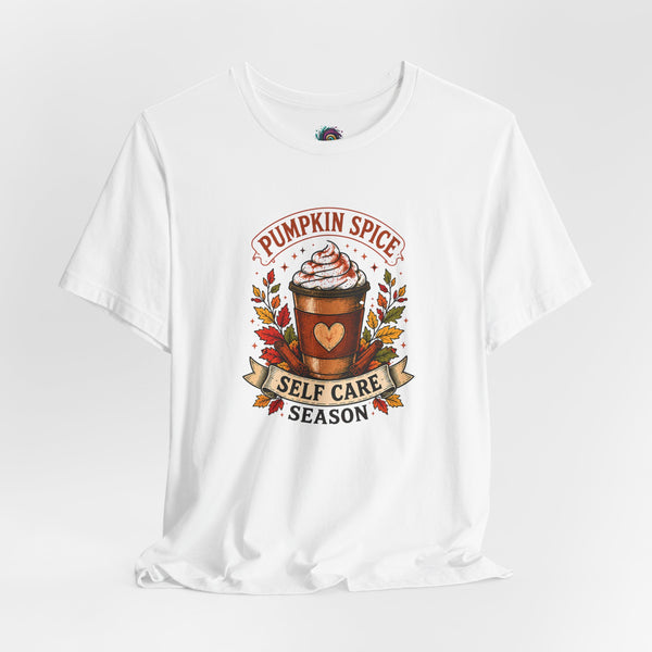 White short-sleeve graphic T-shirt with pumpkin spice coffee cup and “Self Care Season”