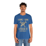 Blue crewneck T-shirt with gold “I Came, I Saw… I Fixed It (Eventually)” graphic on chest.