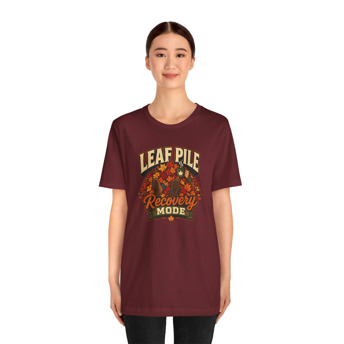 Burgundy short-sleeve graphic T-shirt with leaf pile “Recovery MODE”