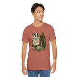 Rust-brown crewneck T-shirt with green cactus “NI Landscaping Service” graphic on chest