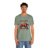 Green graphic T-shirt on model with T-rex “Push-ups” workout slogan print