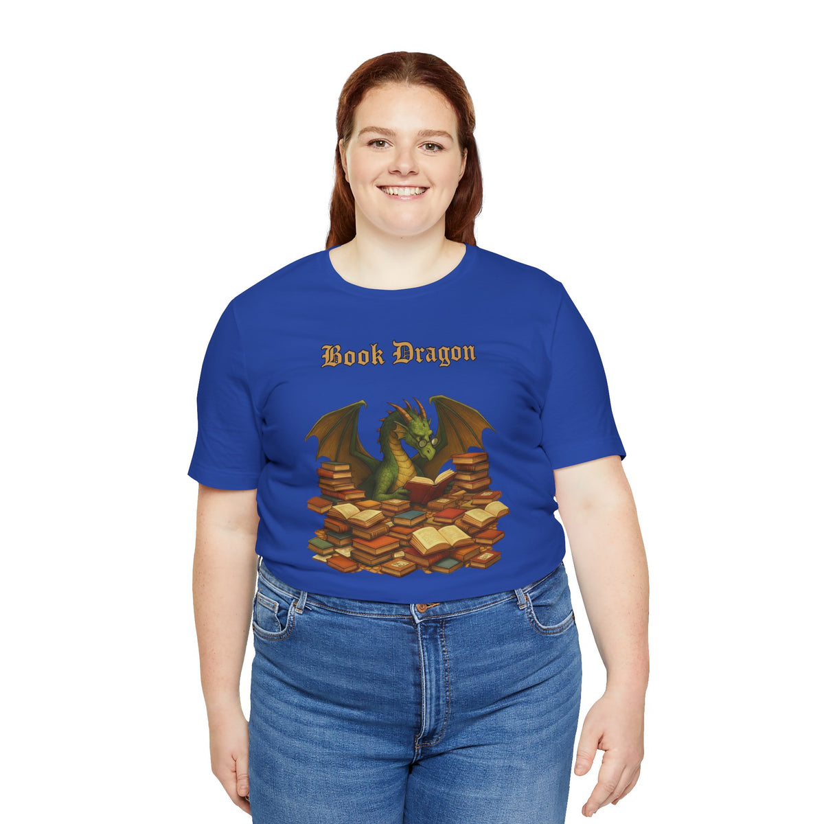 Royal blue t-shirt with dragon and book stack graphic, model standing front
