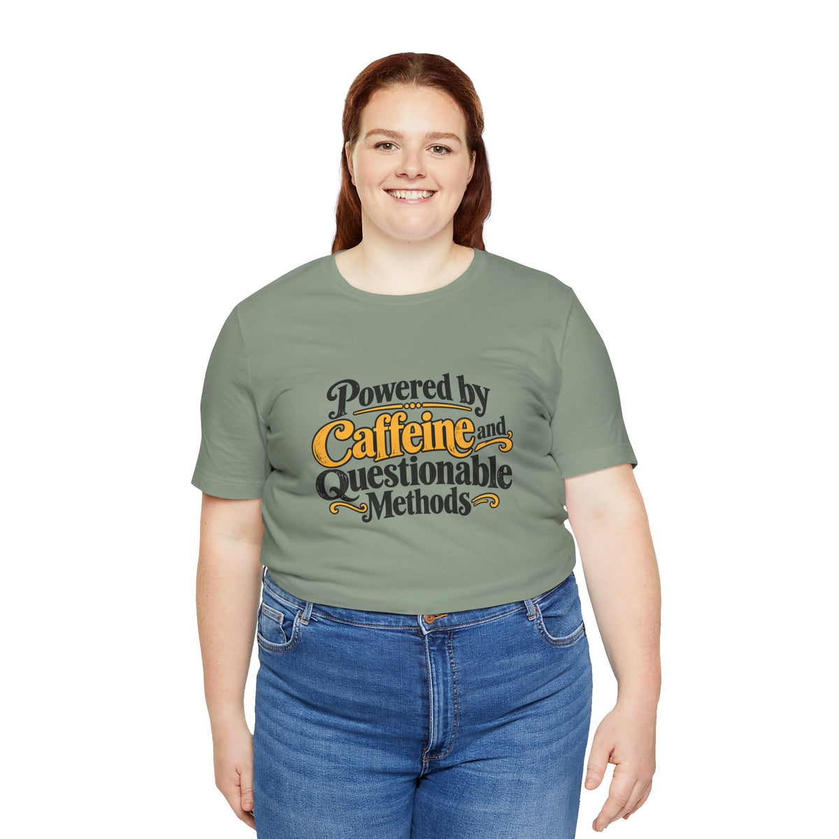Sage green T-shirt with colorful "Powered by Caffeine and Questionable Methods" print