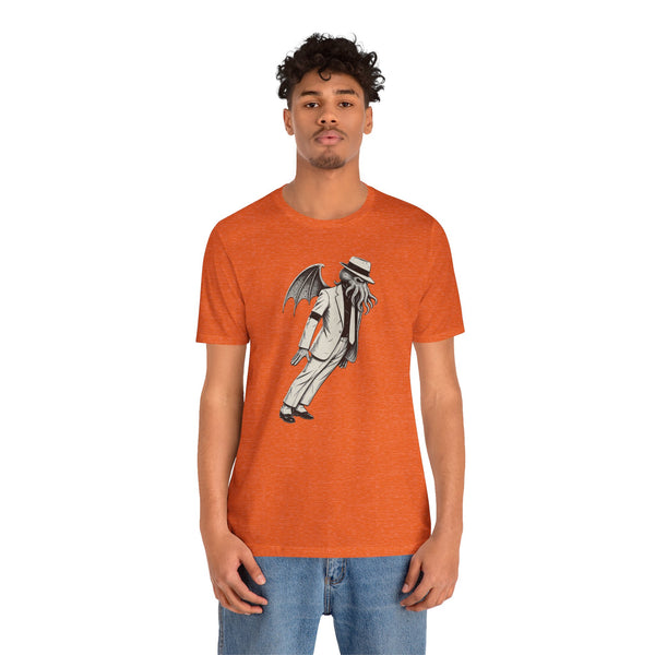Orange crewneck T-shirt with graphic print of a character in dark gray and black