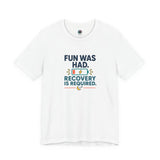 White crew-neck T-shirt with centered multicolor “FUN WAS HAD. RECOVERY IS REQUIRED.” print