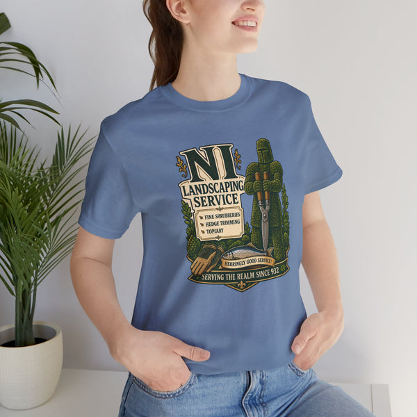 Light blue crewneck T-shirt with “NI Landscaping Service” graphic on the chest, close-up.