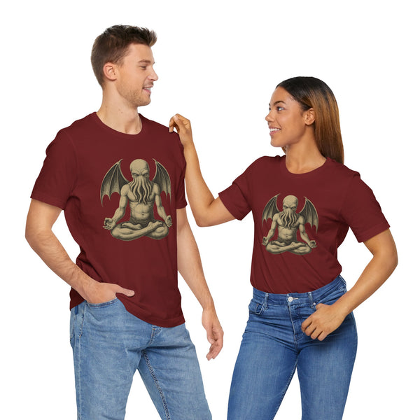Two unisex maroon crewneck T-shirts with meditating octopus-like creature graphic