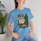 Light blue crewneck T-shirt with green shrub and cactus emblem on front