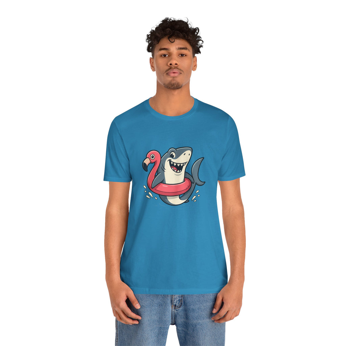 Aqua blue t-shirt with shark and flamingo floatie graphic, front/side view