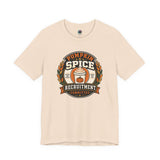 Soft cream crewneck t-shirt with pumpkin-spice themed badge graphic on the chest