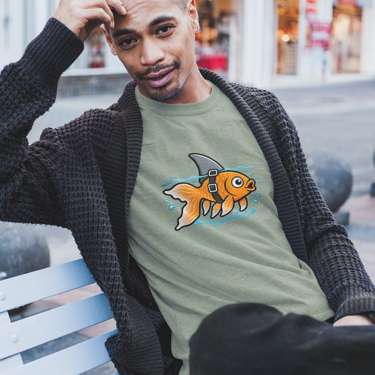 Olive green crewneck T-shirt with goldfish-shark swimming graphic on front