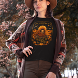 Black crewneck T-shirt with orange pumpkin sci-fi face graphic on the front