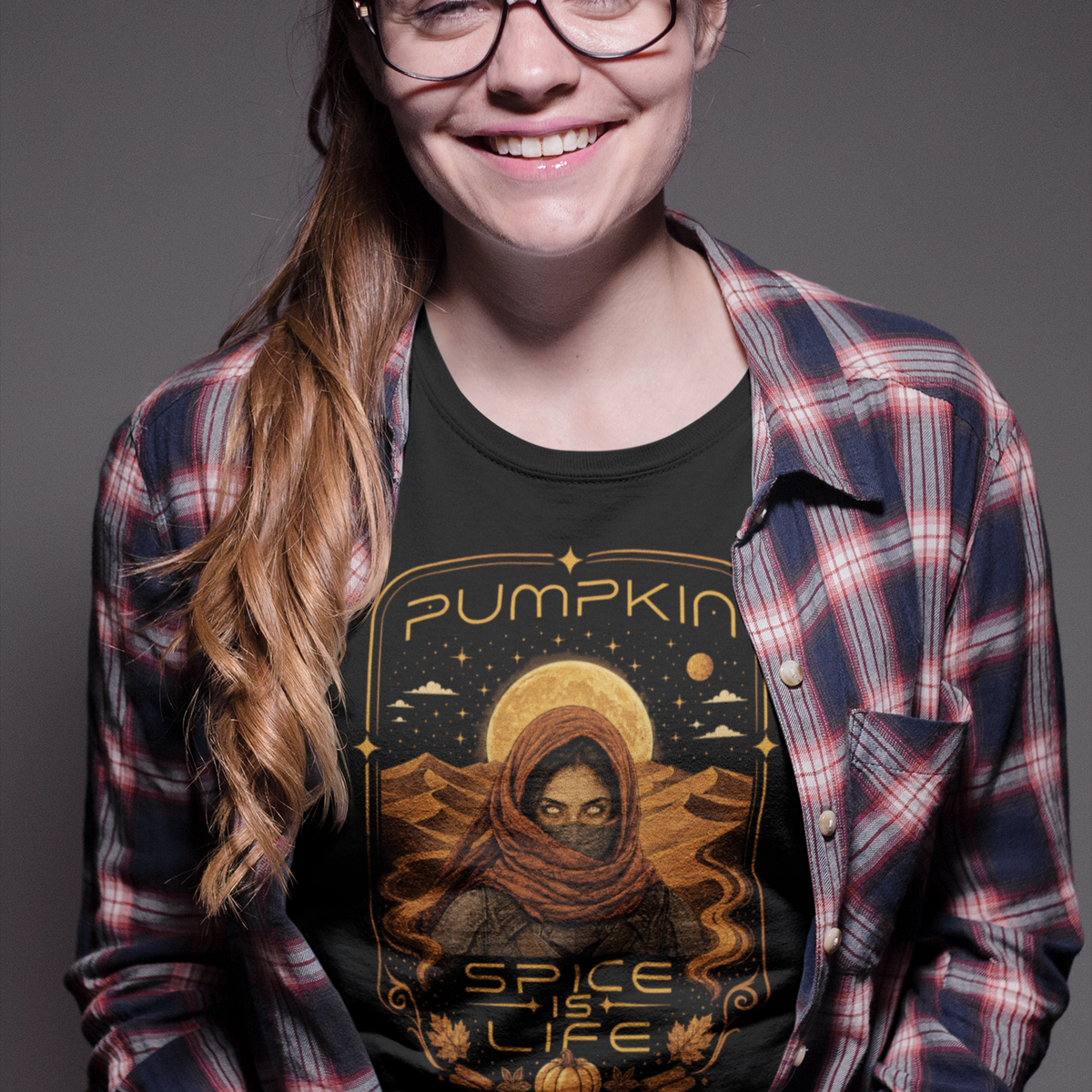 Black crewneck T-shirt with orange pumpkin sci-fi face graphic on the front
