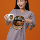 Lavender T-shirt with pumpkin spice emblem graphic, worn by model with coffee mug
