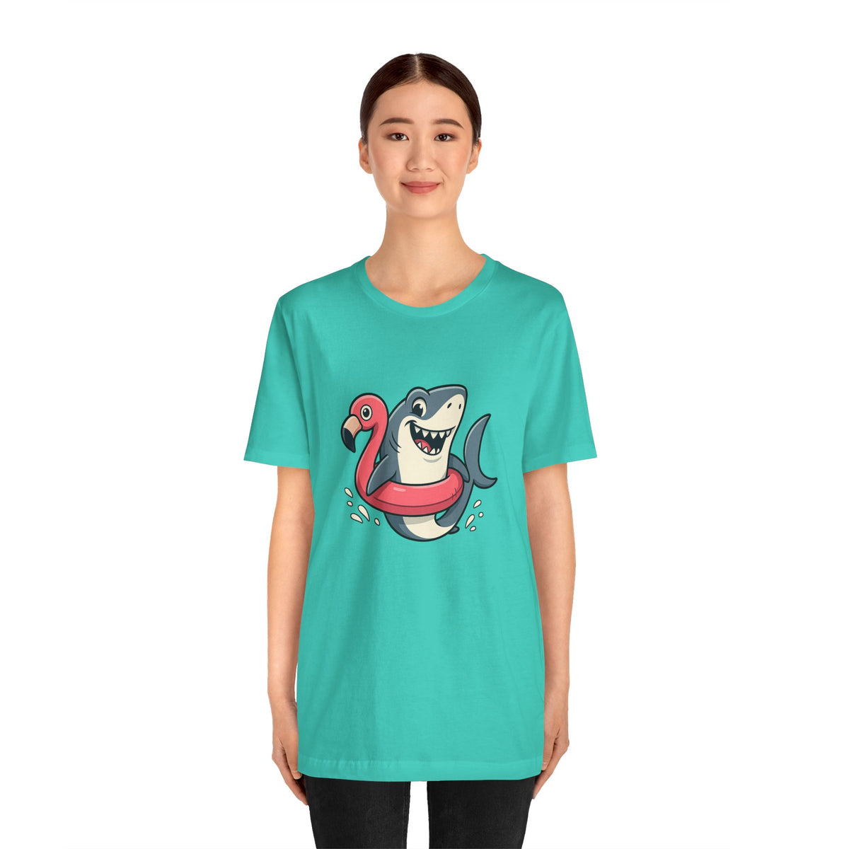 Teal crew-neck T-shirt with shark and flamingo floatie graphic, worn by model