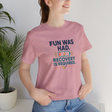 Light pink crewneck T-shirt with multicolor “Recovery is required” graphic on front