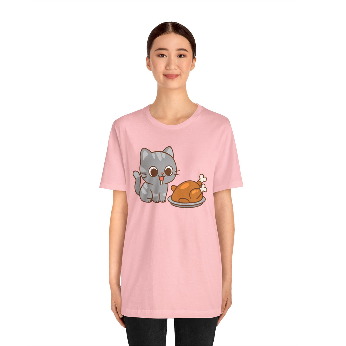 Pink crew-neck T-shirt with gray cat and brown roast graphic, short sleeves.