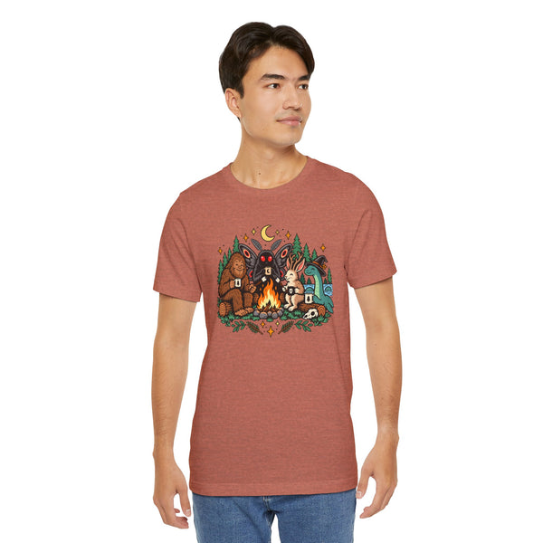 Rust-brown crewneck T-shirt with campfire cryptids graphic, front view