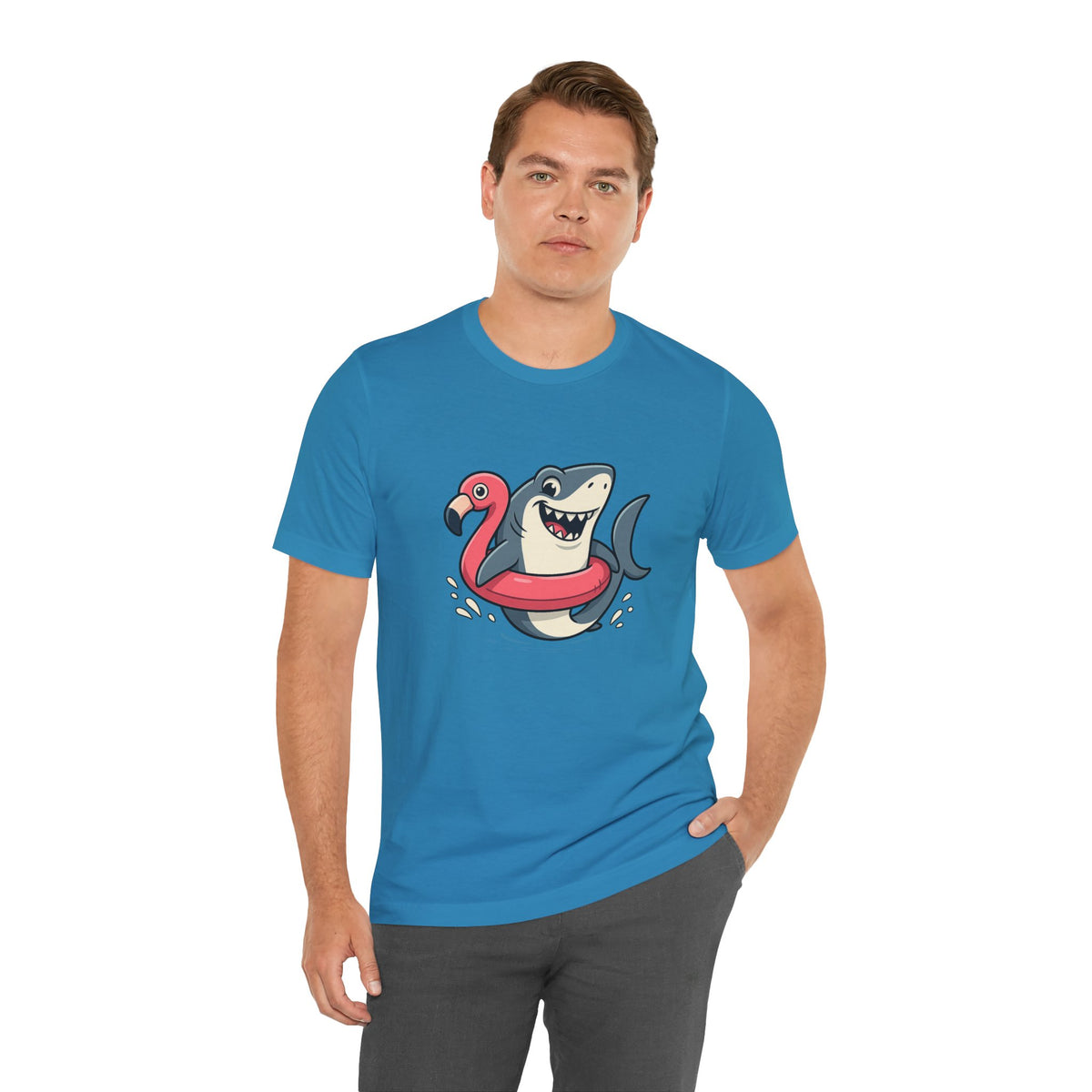 Aqua blue t-shirt with shark and flamingo floatie graphic, relaxed stance