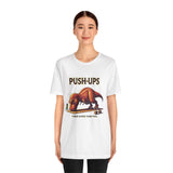 White crewneck T-shirt with PUSH-UPS dinosaur workout graphic on the chest