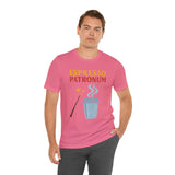 Pink crew-neck T-shirt on model, espresso-themed front graphic with wand and cup
