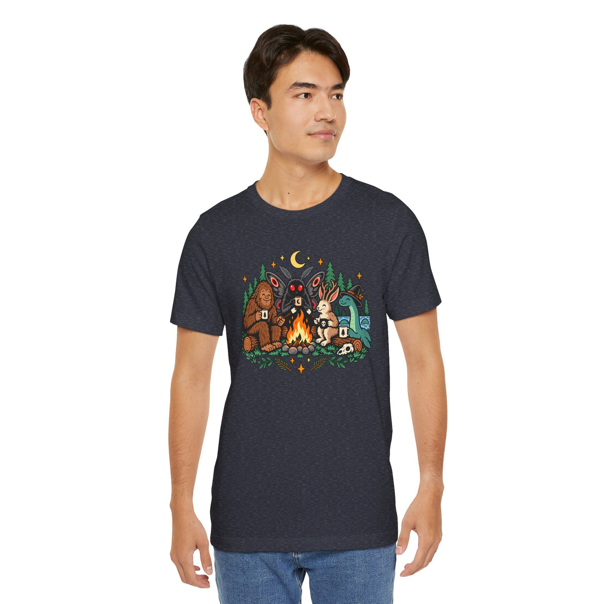 Dark heather crewneck t-shirt with colorful campfire cryptid graphic and forest backdrop