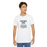 White crew-neck T-shirt with “Recovery is required” graphic