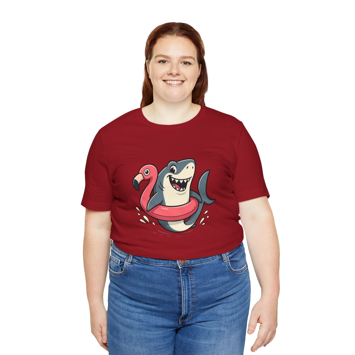 Red short-sleeve crewneck T-shirt featuring a cartoon shark and pink flamingo graphic