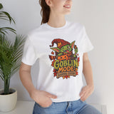 White crew-neck t-shirt with colorful goblin front graphic on a model