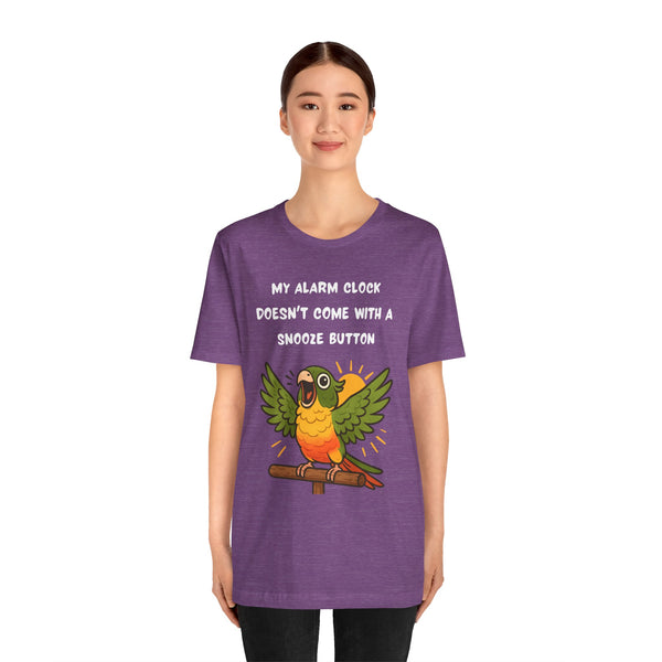 Purple crew-neck t-shirt on model; parrot illustration and alarm clock text on front