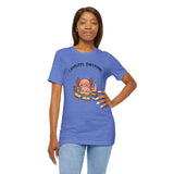Blue crewneck T-shirt with axolotl reading book graphic, hand on hip