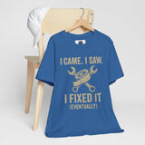 Blue crewneck T-shirt with gold mechanic-themed “I Came, I Saw… I Fixed It (Eventually)” print.