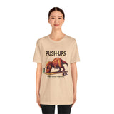 Beige crewneck T-shirt with 'PUSH-UPS' T-rex workout graphic on front