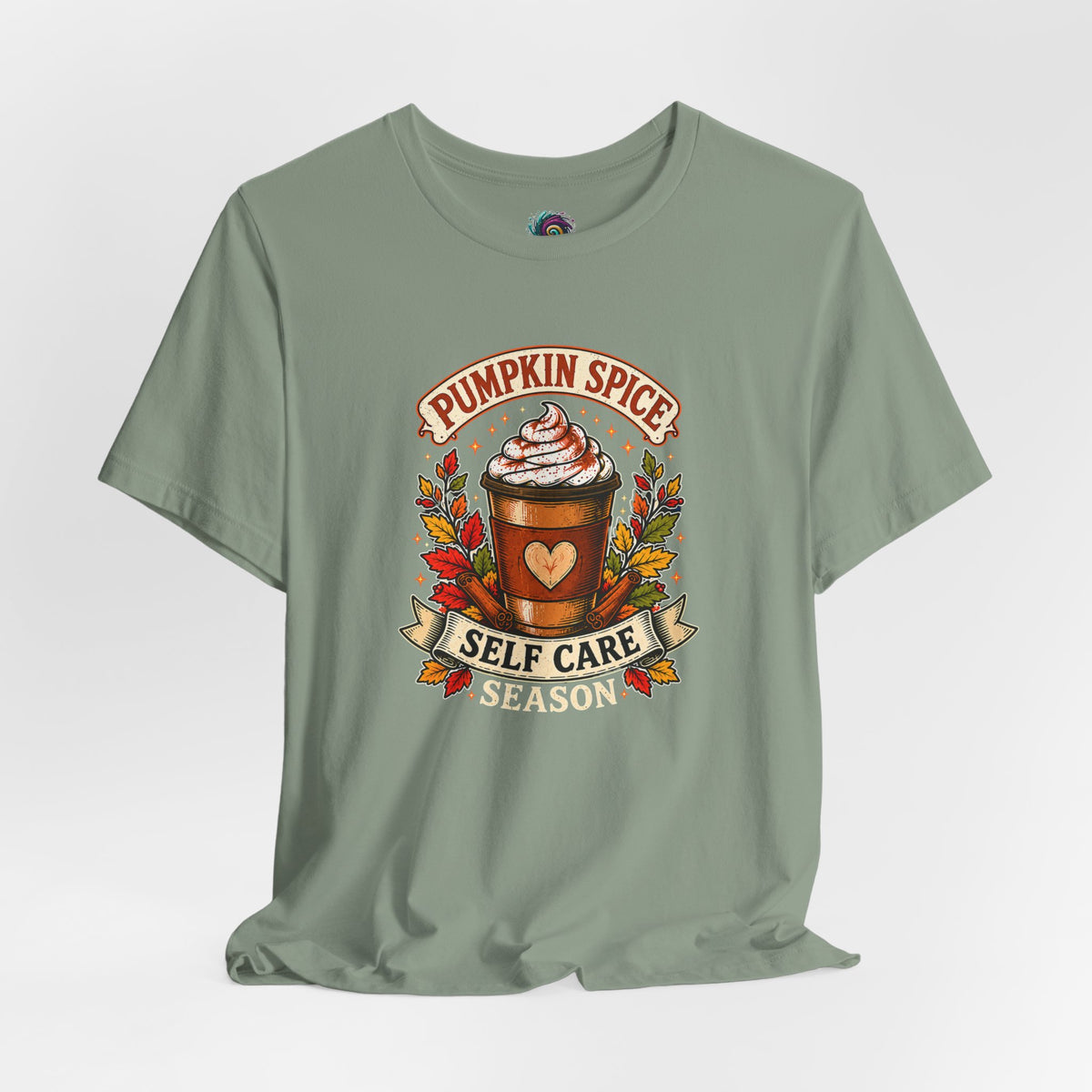 Green T-shirt with "Pumpkin Spice Self Care Season" coffee wreath graphic on chest