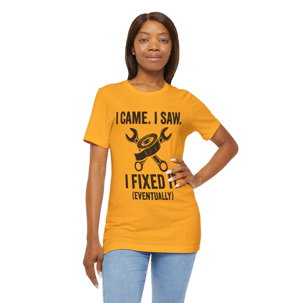 Orange crew-neck T-shirt with black repair tools graphic and text "(EVENTUALLY)"