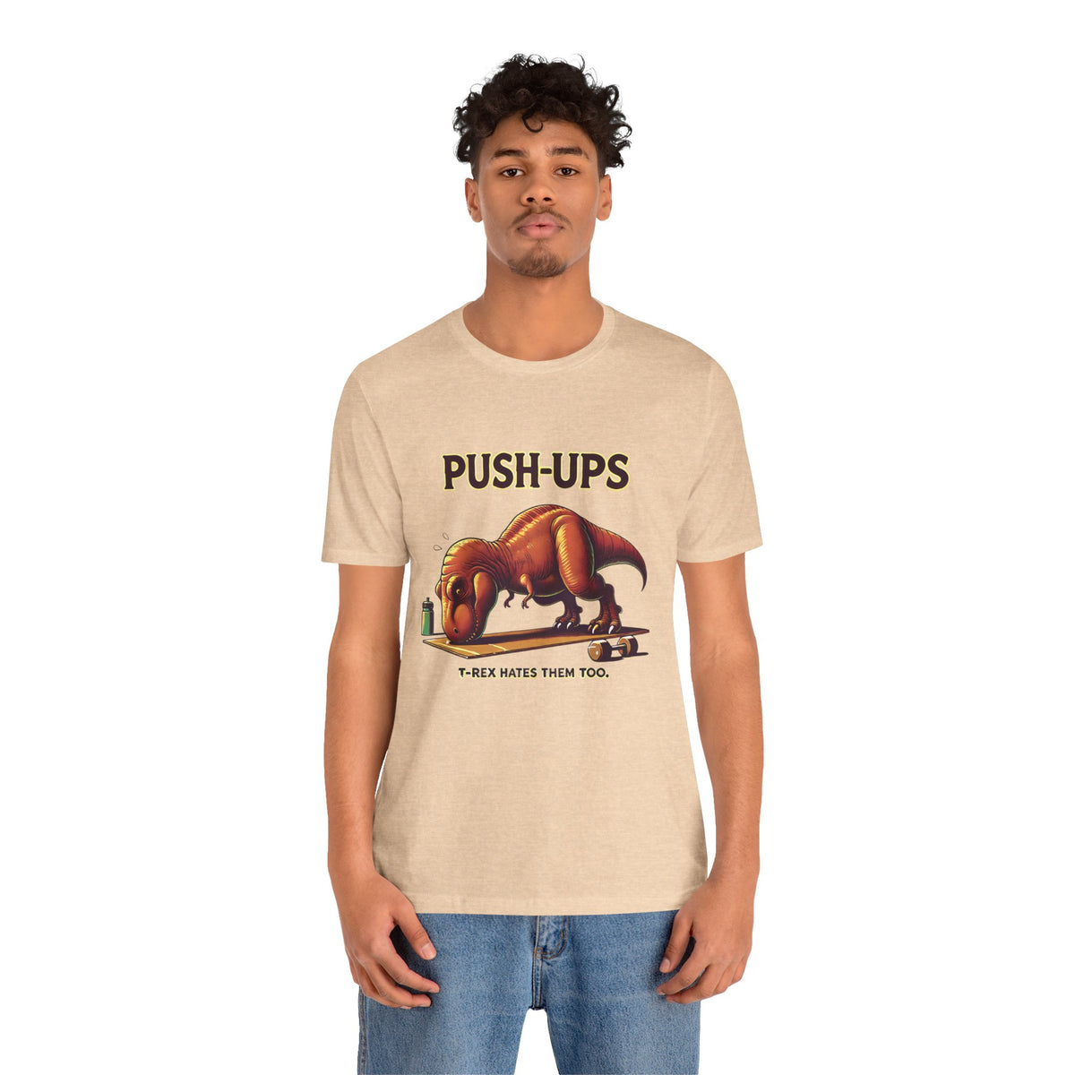 Beige crewneck T-shirt worn by model with 'PUSH-UPS' T-rex workout graphic