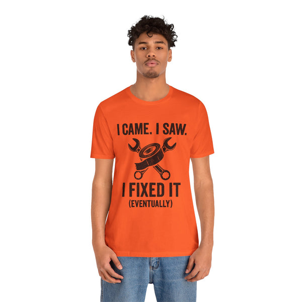 Orange crewneck T-shirt worn by a man, I Came I Saw and I Fixed It (Eventually) print