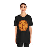 Black crewneck t-shirt with orange circular goddess print centered on chest