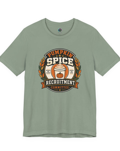 Sage green crewneck t-shirt with pumpkin-spice themed badge graphic on the chest