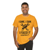 Orange crew-neck T-shirt with black repair-themed graphic and phrase 