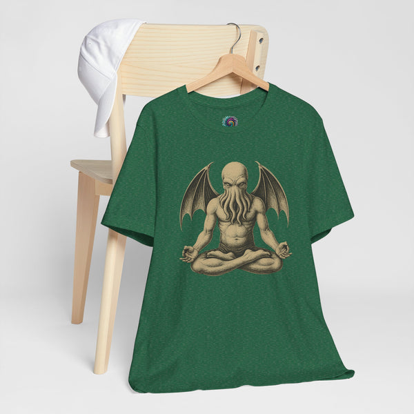 Unisex graphic t-shirt in dark green with meditating Cthulhu-style print on hanger