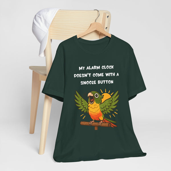 Dark green parrot alarm T-shirt on hanger, front bird graphic and “snooze button” text.