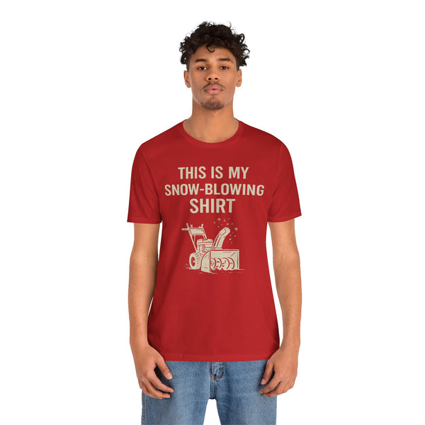 Red short-sleeve T-shirt worn by model, 'THIS IS MY SNOW-BLOWING SHIRT' print