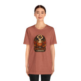 Rust orange graphic T-shirt with pumpkin spice-themed emblem, short sleeves