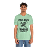 Mint green crew-neck T-shirt with black wrench-and-saw “I fixed it (eventually)” print