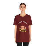 Burgundy t-shirt with “I axolotl questions” axolotl reading graphic on the front