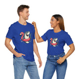Couple wearing matching blue t-shirts with shark and flamingo float graphic