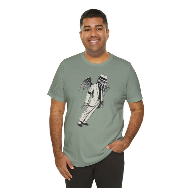 Sage green crew-neck T-shirt featuring a front graphic of top-hat figure with wings